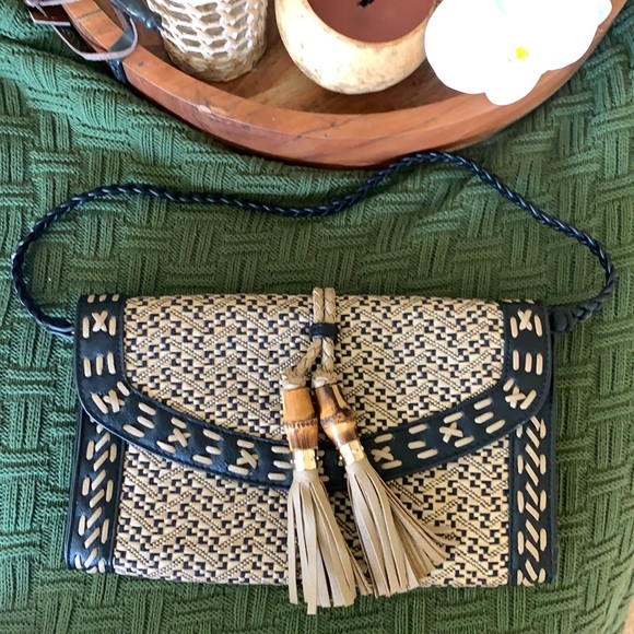 Chico's Handbags - Chico’s clutch with bamboo tassel details.